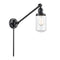 Dover Swing Arm shown in the Matte Black finish with a Clear shade