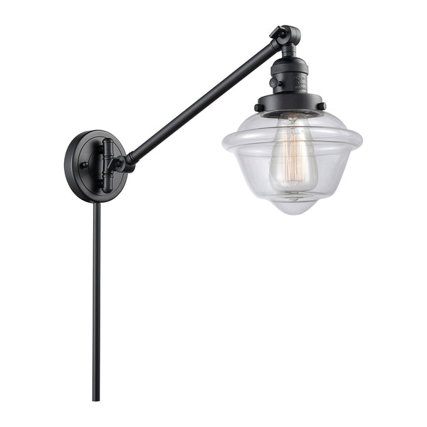Oxford Swing Arm shown in the Matte Black finish with a Clear shade