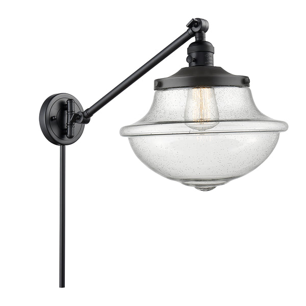 Oxford Swing Arm shown in the Matte Black finish with a Seedy shade