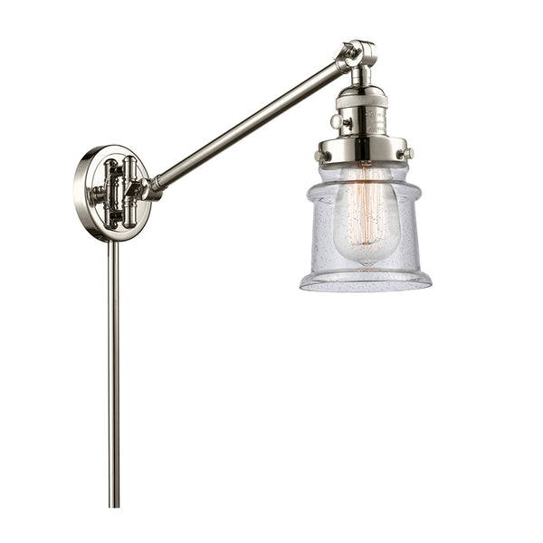 Canton Swing Arm shown in the Polished Nickel finish with a Seedy shade