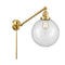 Beacon Swing Arm shown in the Satin Gold finish with a Clear shade