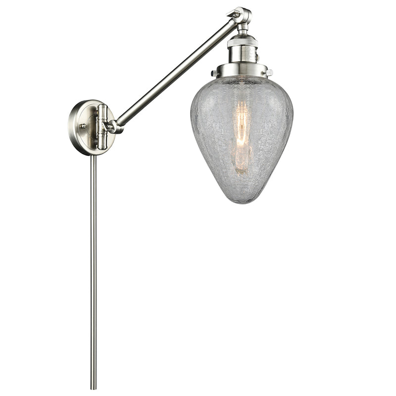 Geneseo Swing Arm shown in the Brushed Satin Nickel finish with a Clear Crackled shade