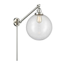 Beacon Swing Arm shown in the Brushed Satin Nickel finish with a Clear shade