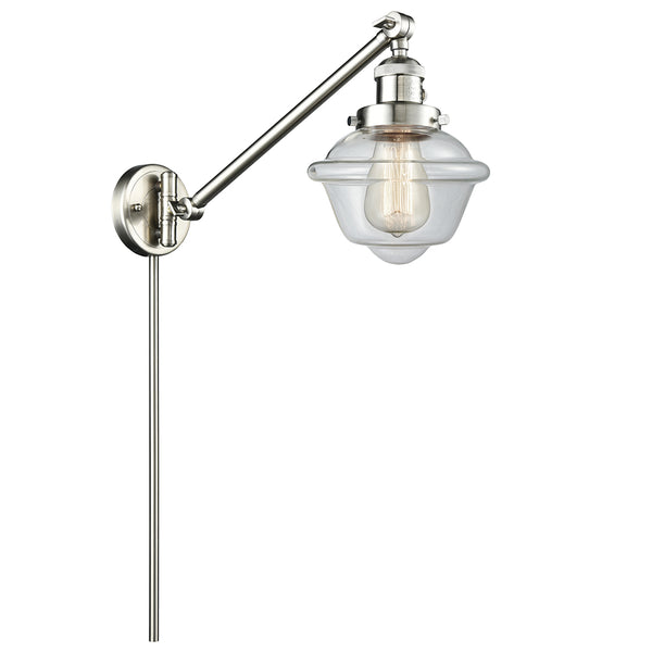 Oxford Swing Arm shown in the Brushed Satin Nickel finish with a Clear shade