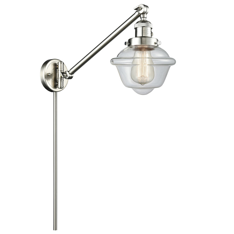 Oxford Swing Arm shown in the Brushed Satin Nickel finish with a Clear shade