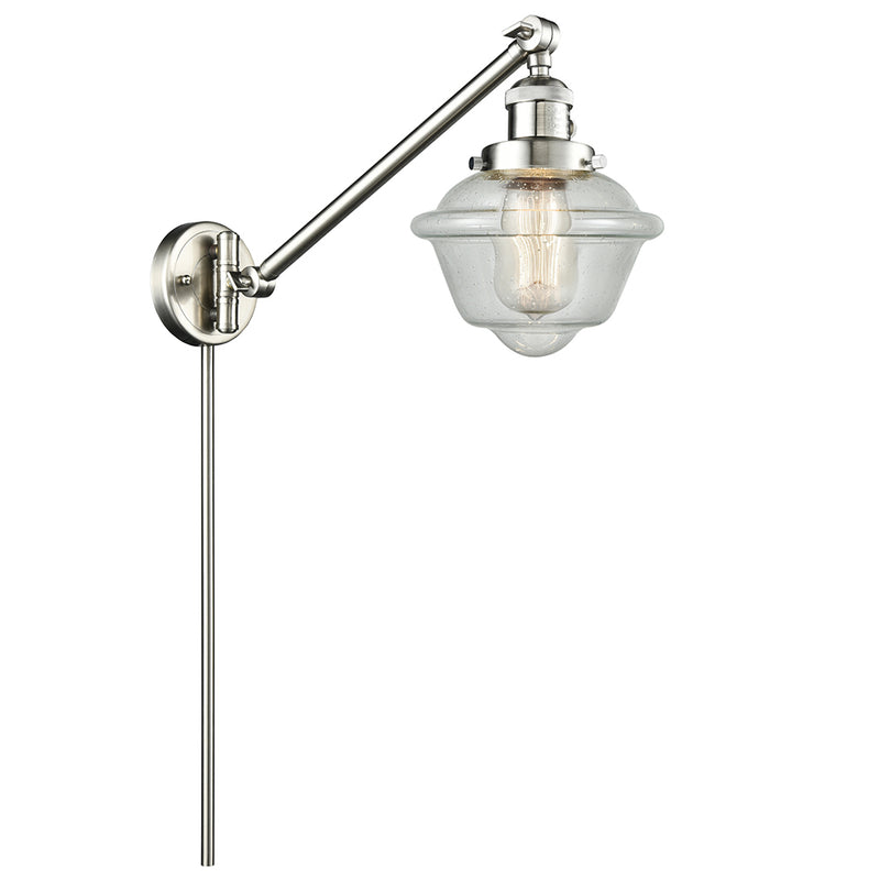 Oxford Swing Arm shown in the Brushed Satin Nickel finish with a Seedy shade