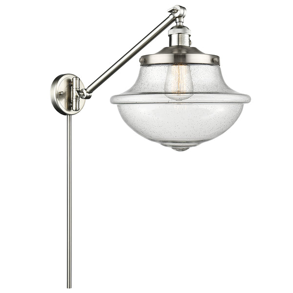 Oxford Swing Arm shown in the Brushed Satin Nickel finish with a Seedy shade