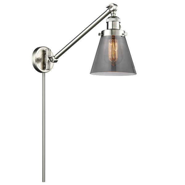 Cone Swing Arm shown in the Brushed Satin Nickel finish with a Plated Smoke shade