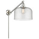 Bell Swing Arm shown in the Brushed Satin Nickel finish with a Seedy shade