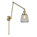 Chatham Swing Arm shown in the Antique Brass finish with a Clear shade