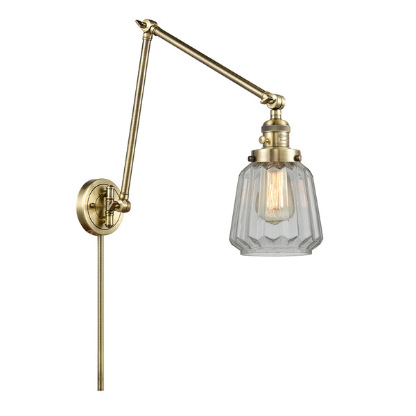 Chatham Swing Arm shown in the Antique Brass finish with a Clear shade