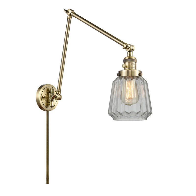 Chatham Swing Arm shown in the Antique Brass finish with a Clear shade