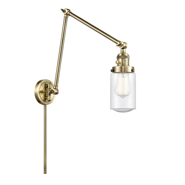 Dover Swing Arm shown in the Antique Brass finish with a Seedy shade