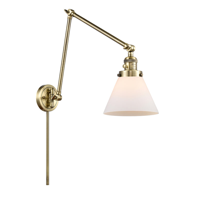 Cone Swing Arm shown in the Antique Brass finish with a Matte White shade