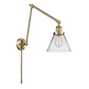 Cone Swing Arm shown in the Antique Brass finish with a Clear shade