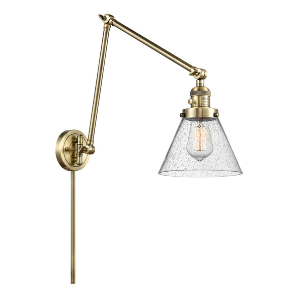 Cone Swing Arm shown in the Antique Brass finish with a Seedy shade
