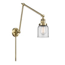 Bell Swing Arm shown in the Antique Brass finish with a Clear shade