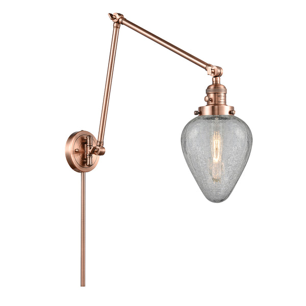 Geneseo Swing Arm shown in the Antique Copper finish with a Clear Crackled shade