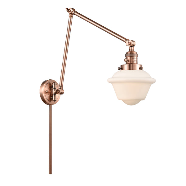 Oxford Swing Arm shown in the Antique Copper finish with a Matte White shade