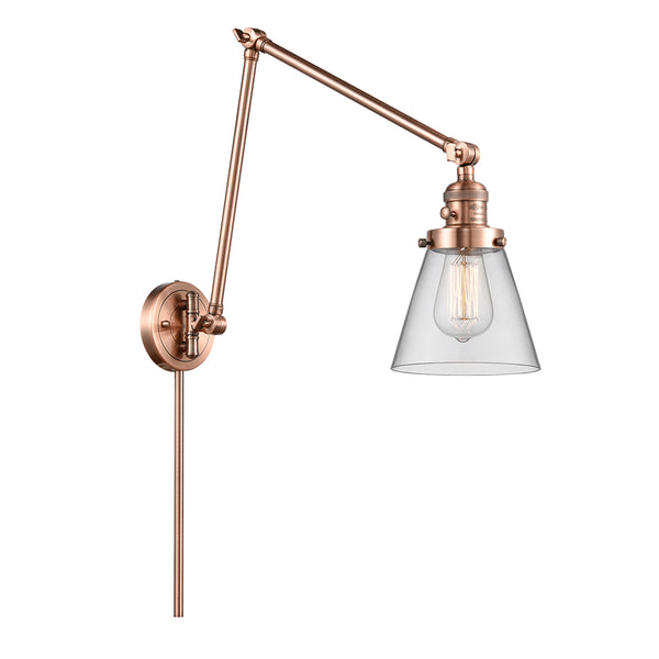 Cone Swing Arm shown in the Antique Copper finish with a Clear shade