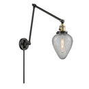 Geneseo Swing Arm shown in the Black Antique Brass finish with a Clear Crackled shade