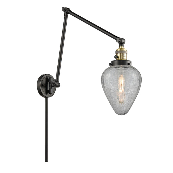 Geneseo Swing Arm shown in the Black Antique Brass finish with a Clear Crackled shade