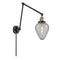 Geneseo Swing Arm shown in the Black Antique Brass finish with a Clear Crackled shade