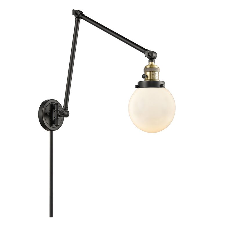 Beacon Swing Arm shown in the Black Antique Brass finish with a Matte White shade