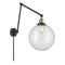 Beacon Swing Arm shown in the Black Antique Brass finish with a Clear shade
