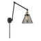 Cone Swing Arm shown in the Black Antique Brass finish with a Plated Smoke shade
