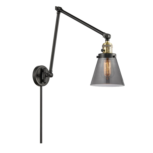 Cone Swing Arm shown in the Black Antique Brass finish with a Plated Smoke shade