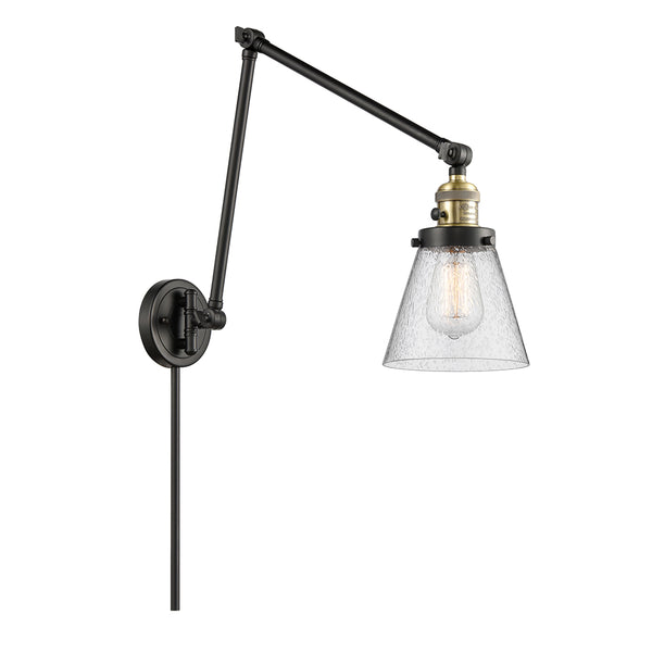 Cone Swing Arm shown in the Black Antique Brass finish with a Seedy shade