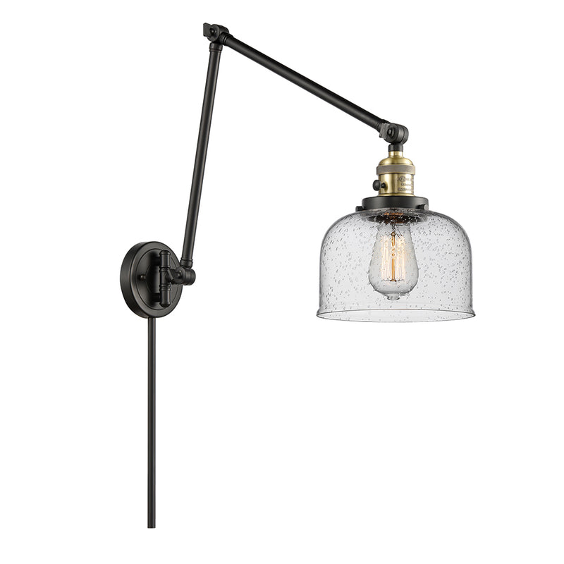Bell Swing Arm shown in the Black Antique Brass finish with a Seedy shade