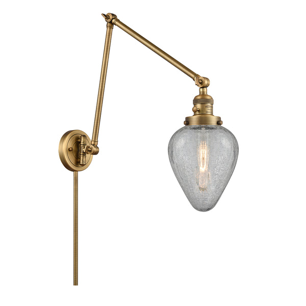 Geneseo Swing Arm shown in the Brushed Brass finish with a Clear Crackled shade