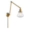Olean Swing Arm shown in the Brushed Brass finish with a Clear shade