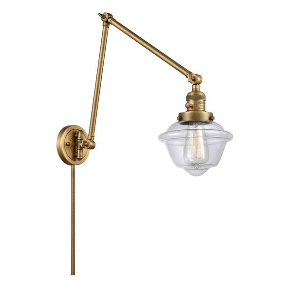 Oxford Swing Arm shown in the Brushed Brass finish with a Clear shade