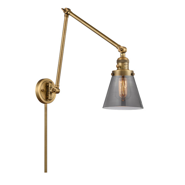 Cone Swing Arm shown in the Brushed Brass finish with a Plated Smoke shade