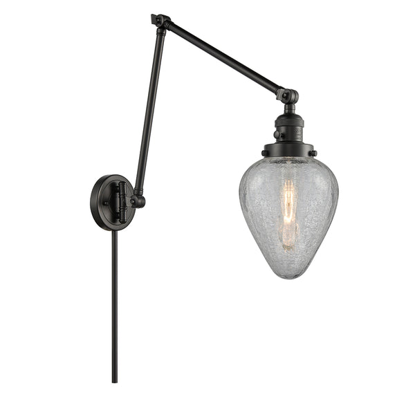 Geneseo Swing Arm shown in the Matte Black finish with a Clear Crackled shade