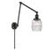 Colton Swing Arm shown in the Matte Black finish with a Clear Halophane shade