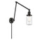 Dover Swing Arm shown in the Matte Black finish with a Seedy shade