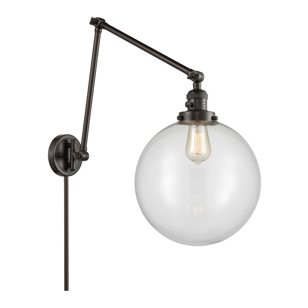 Beacon Swing Arm shown in the Oil Rubbed Bronze finish with a Clear shade