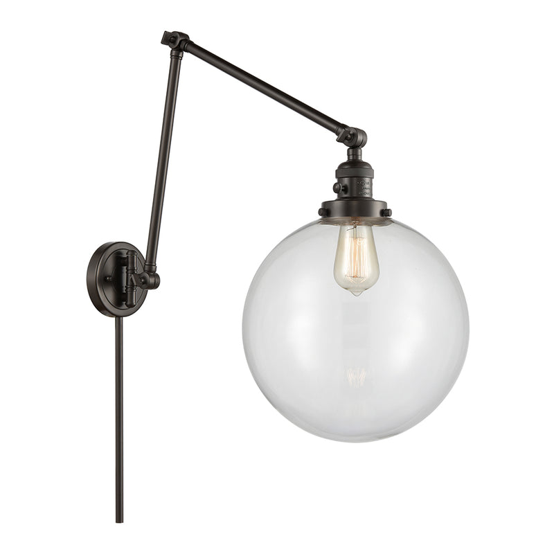 Beacon Swing Arm shown in the Oil Rubbed Bronze finish with a Clear shade