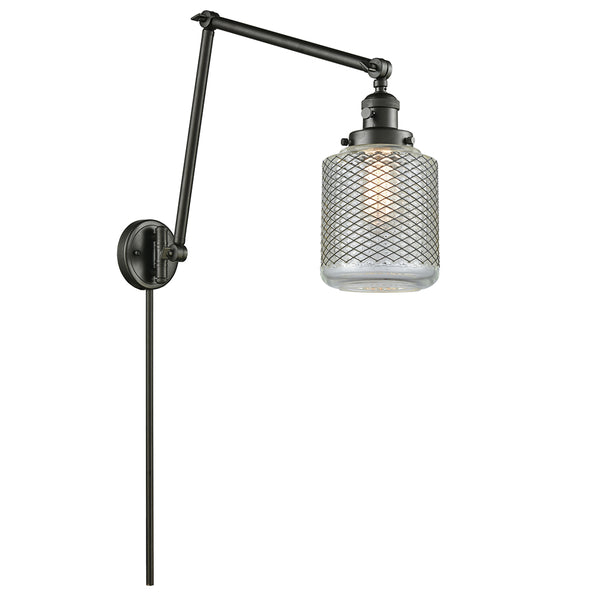 Stanton Swing Arm shown in the Oil Rubbed Bronze finish with a Clear Wire Mesh shade