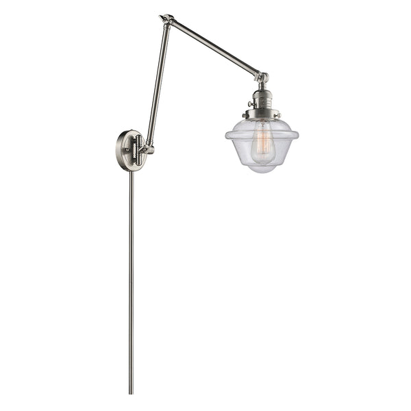 Oxford Swing Arm shown in the Brushed Satin Nickel finish with a Seedy shade