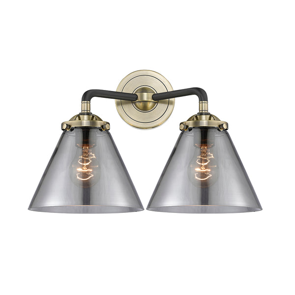 Cone Bath Vanity Light shown in the Black Antique Brass finish with a Plated Smoke shade