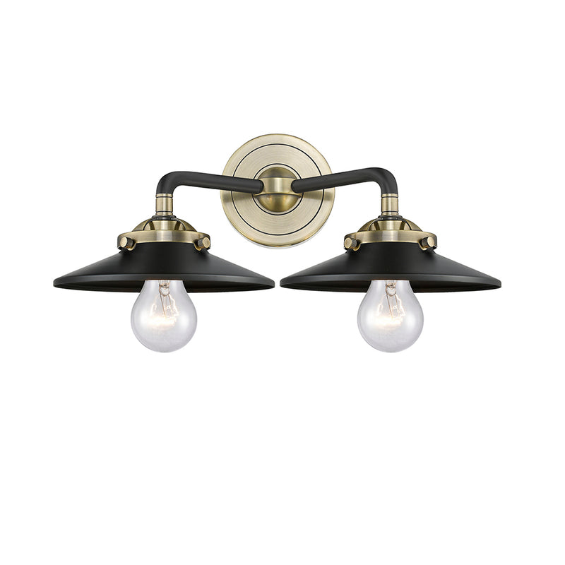 Railroad Bath Vanity Light shown in the Black Antique Brass finish with a Matte Black shade