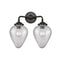 Geneseo Bath Vanity Light shown in the Oil Rubbed Bronze finish with a Clear Crackled shade