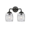 Colton Bath Vanity Light shown in the Oil Rubbed Bronze finish with a Clear Halophane shade