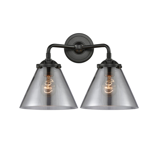 Cone Bath Vanity Light shown in the Oil Rubbed Bronze finish with a Plated Smoke shade