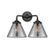 Cone Bath Vanity Light shown in the Oil Rubbed Bronze finish with a Plated Smoke shade